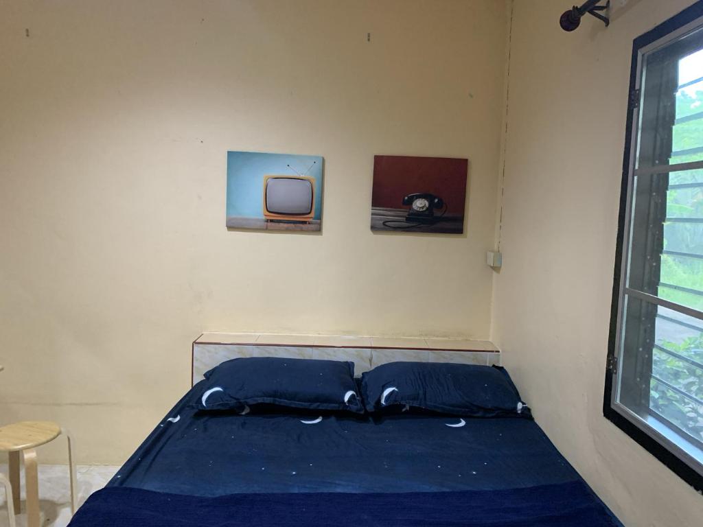 Postel nebo postele na pokoji v ubytování วังตาน้ำรีสอร์ท