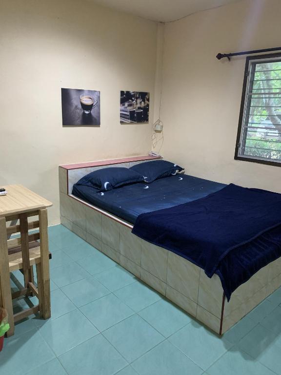 Postel nebo postele na pokoji v ubytování วังตาน้ำรีสอร์ท