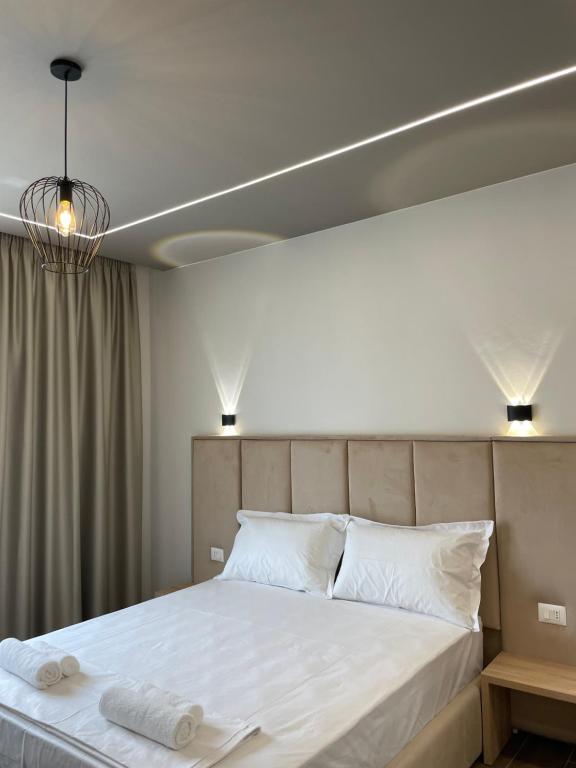 Postel nebo postele na pokoji v ubytování Hotel Lubjana