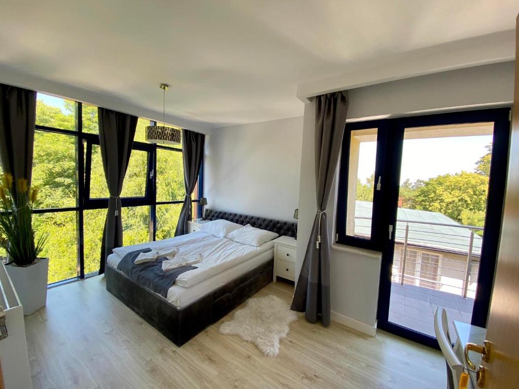 Postel nebo postele na pokoji v ubytování Villa Dominik