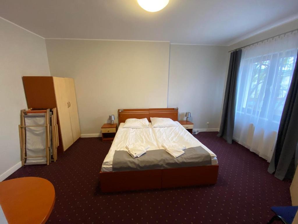 Postel nebo postele na pokoji v ubytování Villa Dominik