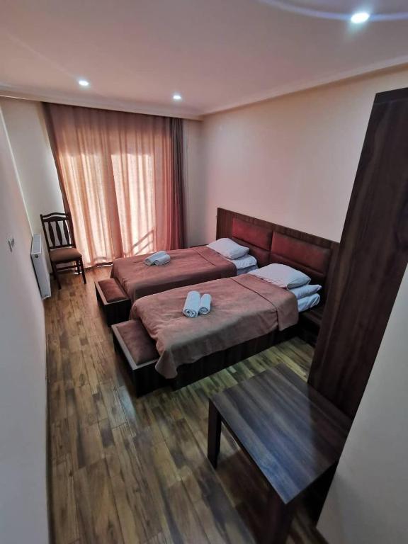 Postel nebo postele na pokoji v ubytování Hotel Ramaz Paliani