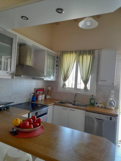 A kitchen or kitchenette at Derveni Summer House