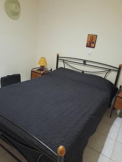 A bed or beds in a room at Derveni Summer House