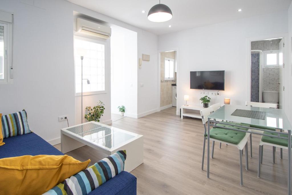 Televízia a/alebo spoločenská miestnosť v ubytovaní Apartamento Ooh La Lá Cádiz