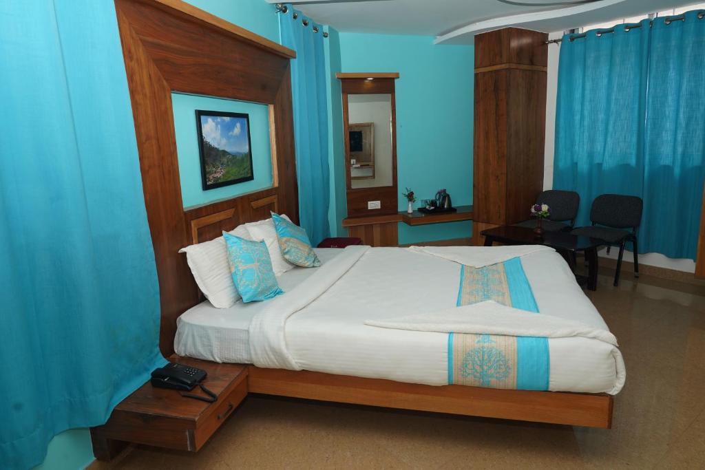 Postel nebo postele na pokoji v ubytování Anika Palace by Pepe Inn Hotel