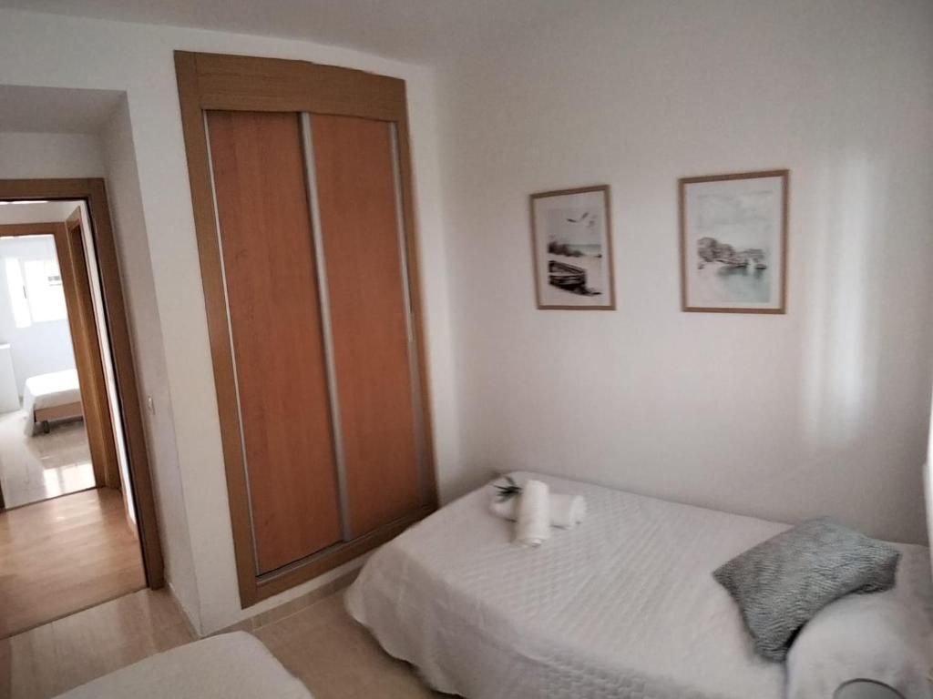 A bed or beds in a room at Confort y Relax