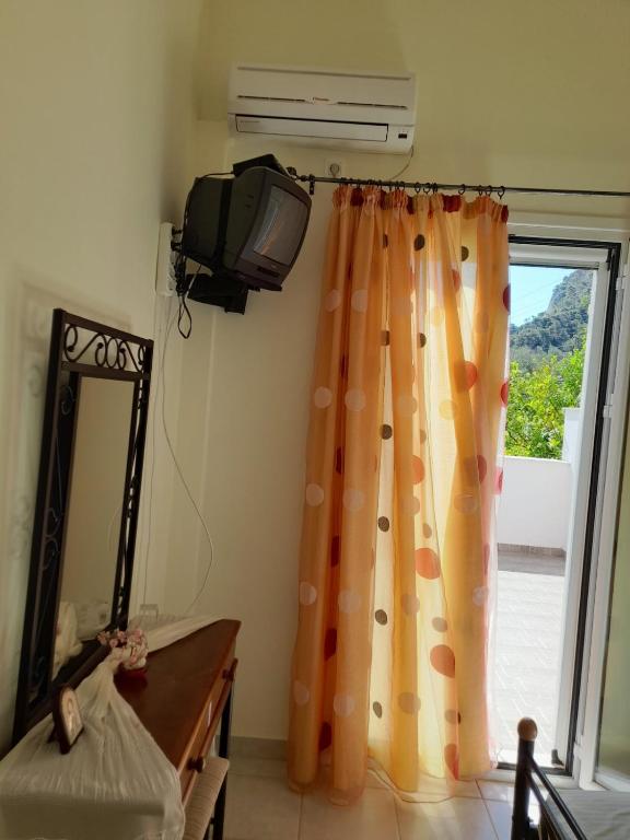 A bed or beds in a room at Derveni Summer House