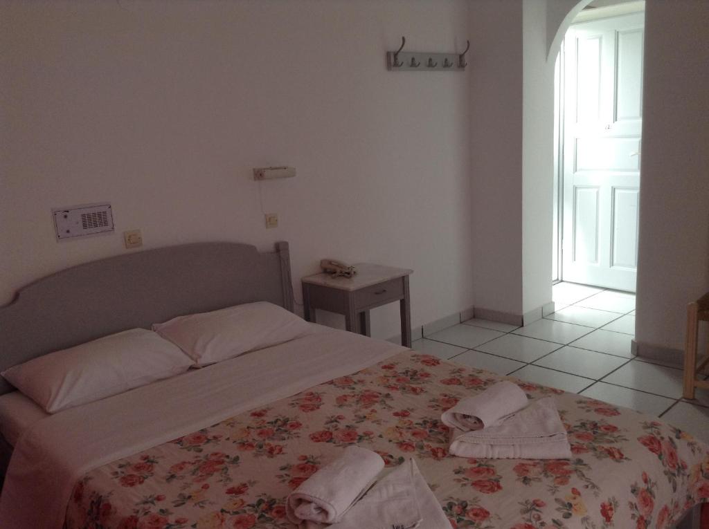 Postel nebo postele na pokoji v ubytování King Thiras Hotel
