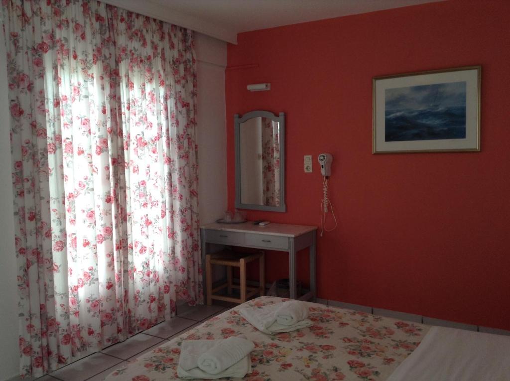 Postel nebo postele na pokoji v ubytování King Thiras Hotel