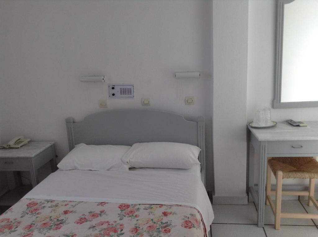Postel nebo postele na pokoji v ubytování King Thiras Hotel