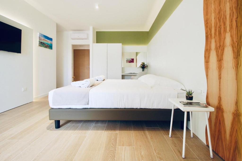 A bed or beds in a room at Hotel Olivò