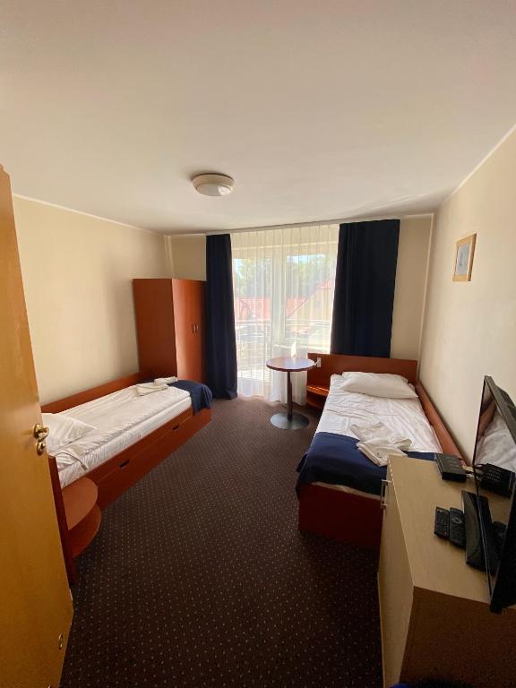 Postel nebo postele na pokoji v ubytování Villa Dominik