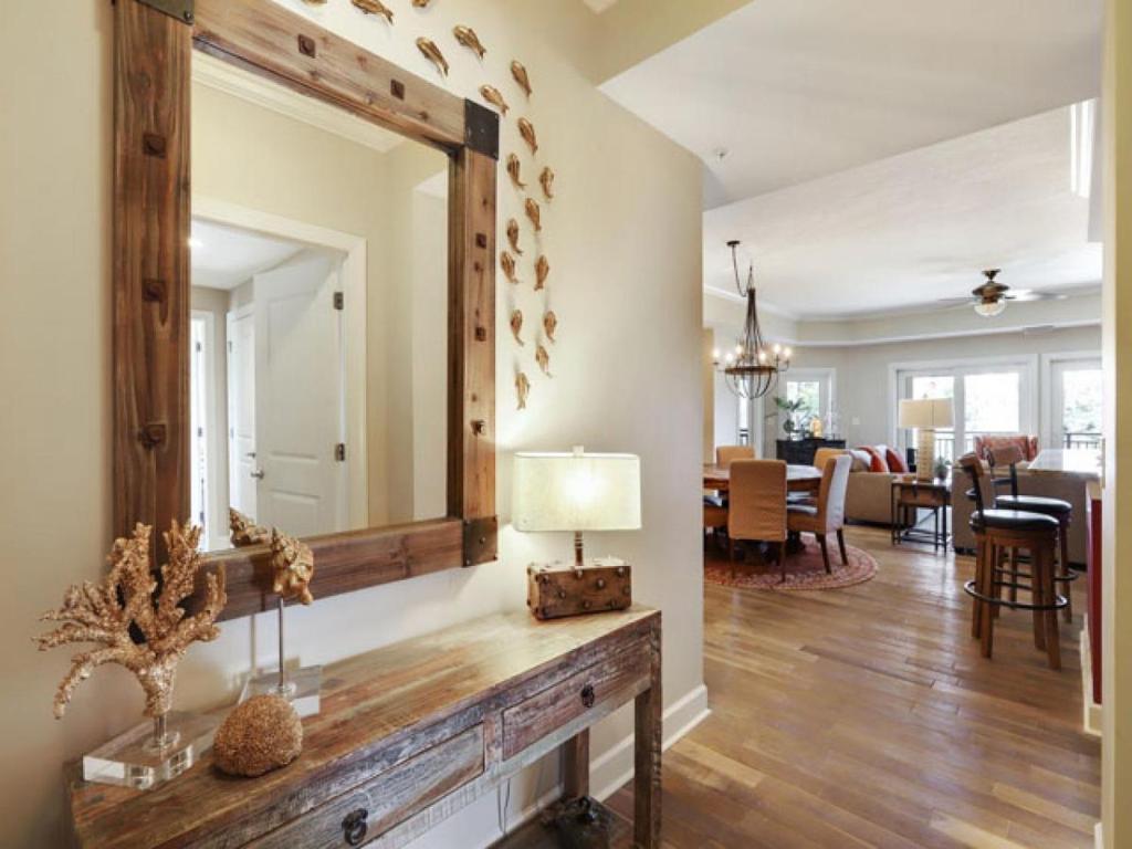 a large mirror on a wall in a living room at 307 Main Sail in Hilton Head Island