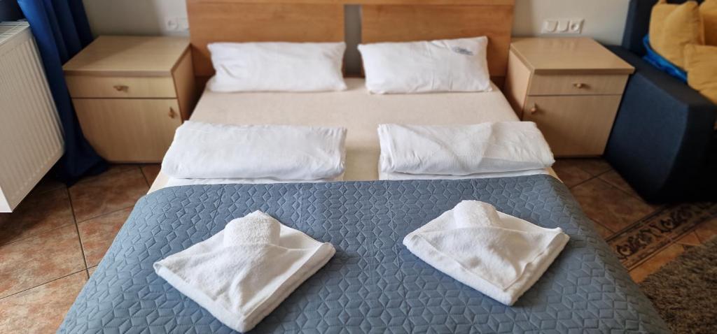Posteľ alebo postele v izbe v ubytovaní Apartament Hexagon nr 21