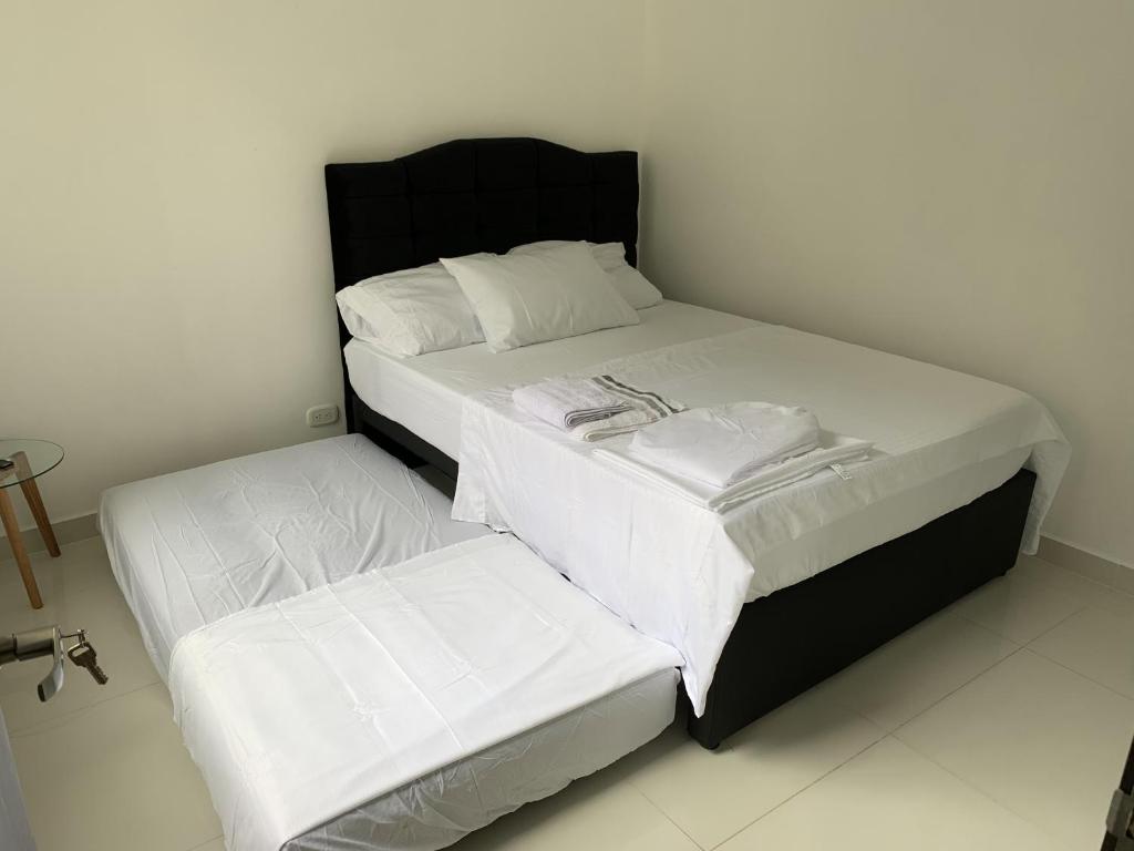 Postel nebo postele na pokoji v ubytování Mango Home