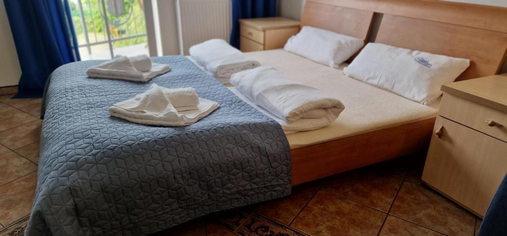 Posteľ alebo postele v izbe v ubytovaní Apartament Hexagon nr 21