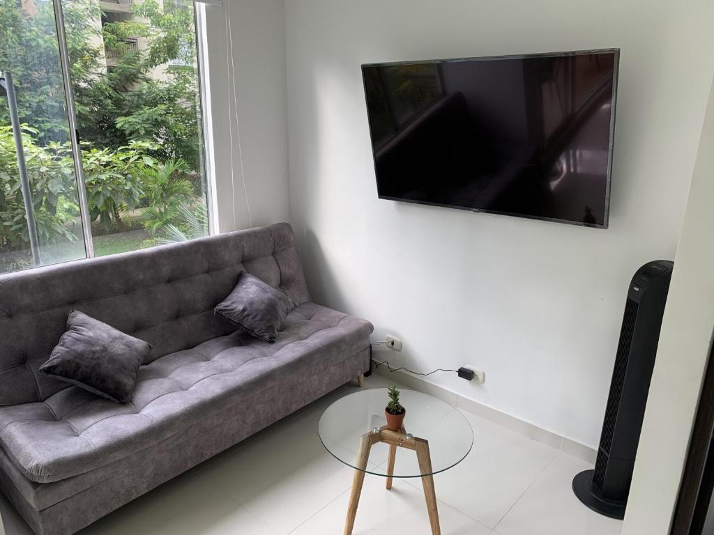 TV a/nebo společenská místnost v ubytování Mango Home