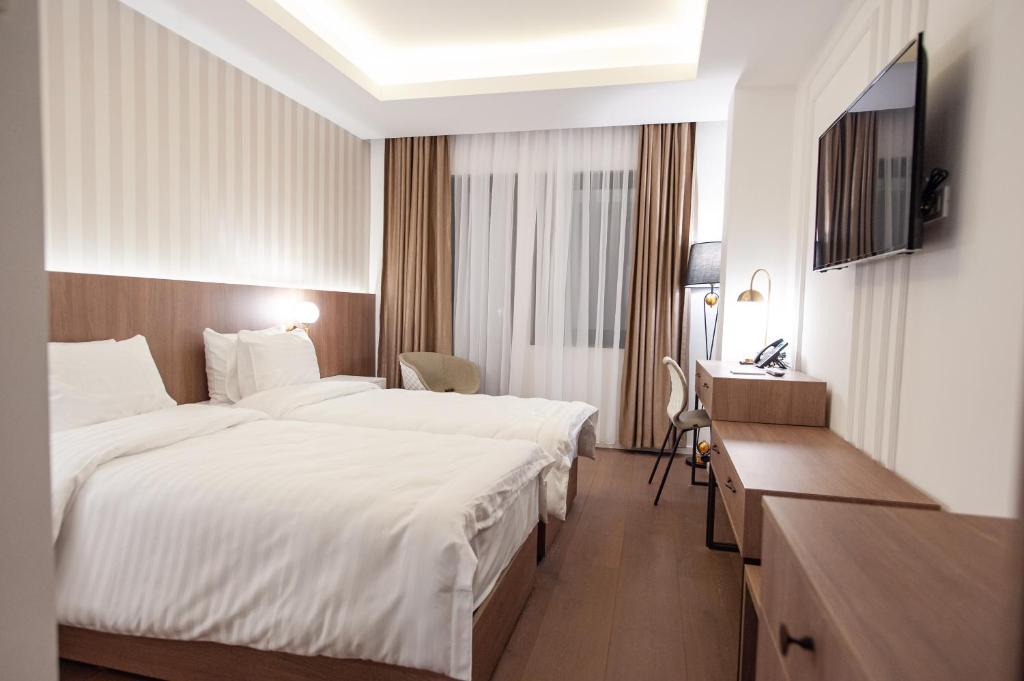 Postel nebo postele na pokoji v ubytování Hotel Freya