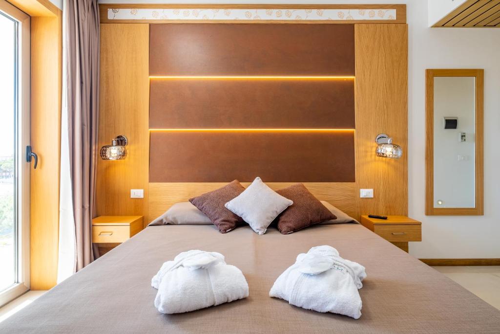 Postel nebo postele na pokoji v ubytování Hotel Mare