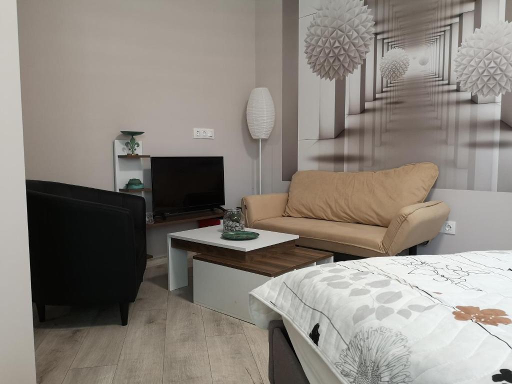 Telewizja i/lub zestaw kina domowego w obiekcie Bokor vendégház - Levendula apartman