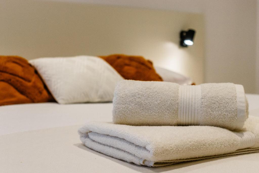 Postel nebo postele na pokoji v ubytování Apartments KIWI