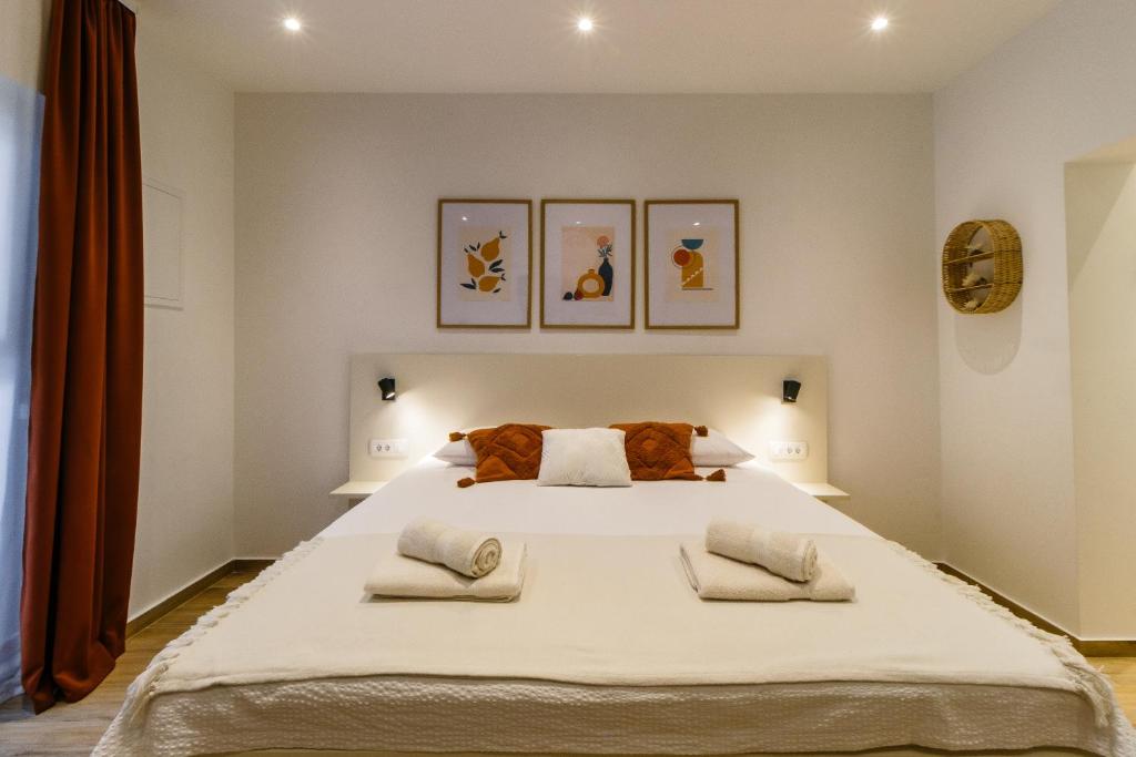 Postel nebo postele na pokoji v ubytování Apartments KIWI