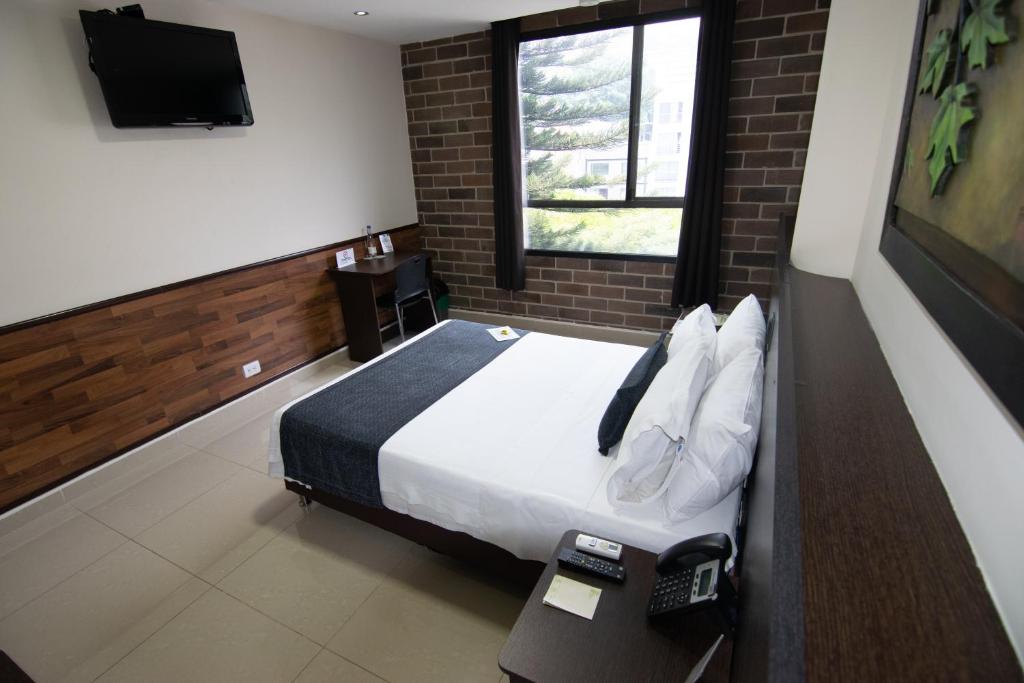 TV a/nebo společenská místnost v ubytování Hotel Acqua Medellín
