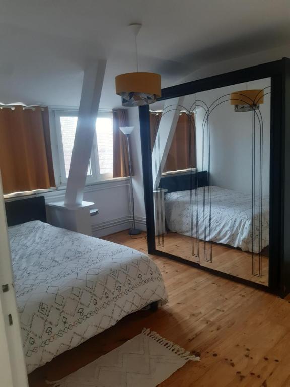 Posteľ alebo postele v izbe v ubytovaní Appartement Malo les Bains à deux pas de la plage