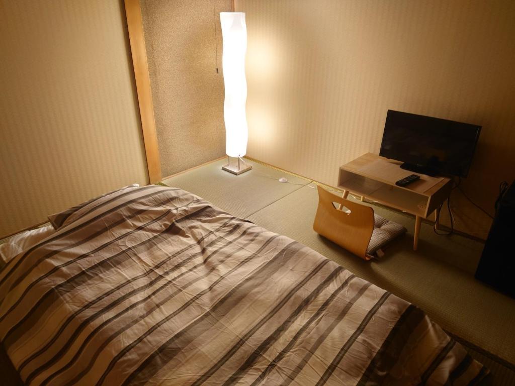 Ein Bett oder Betten in einem Zimmer der Unterkunft Chizu - Vacation STAY 83928v