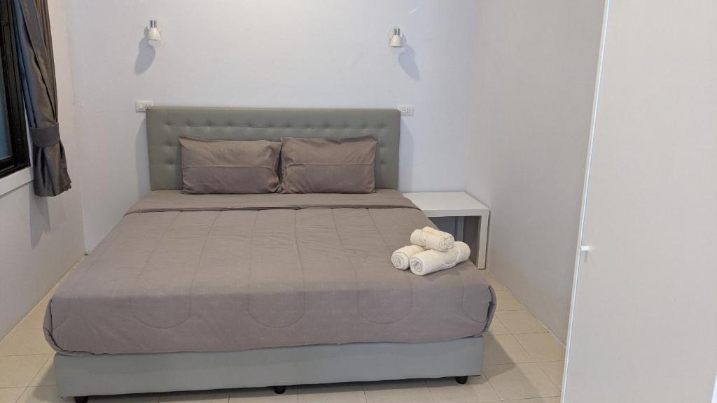 Postel nebo postele na pokoji v ubytování Bann Kanchana