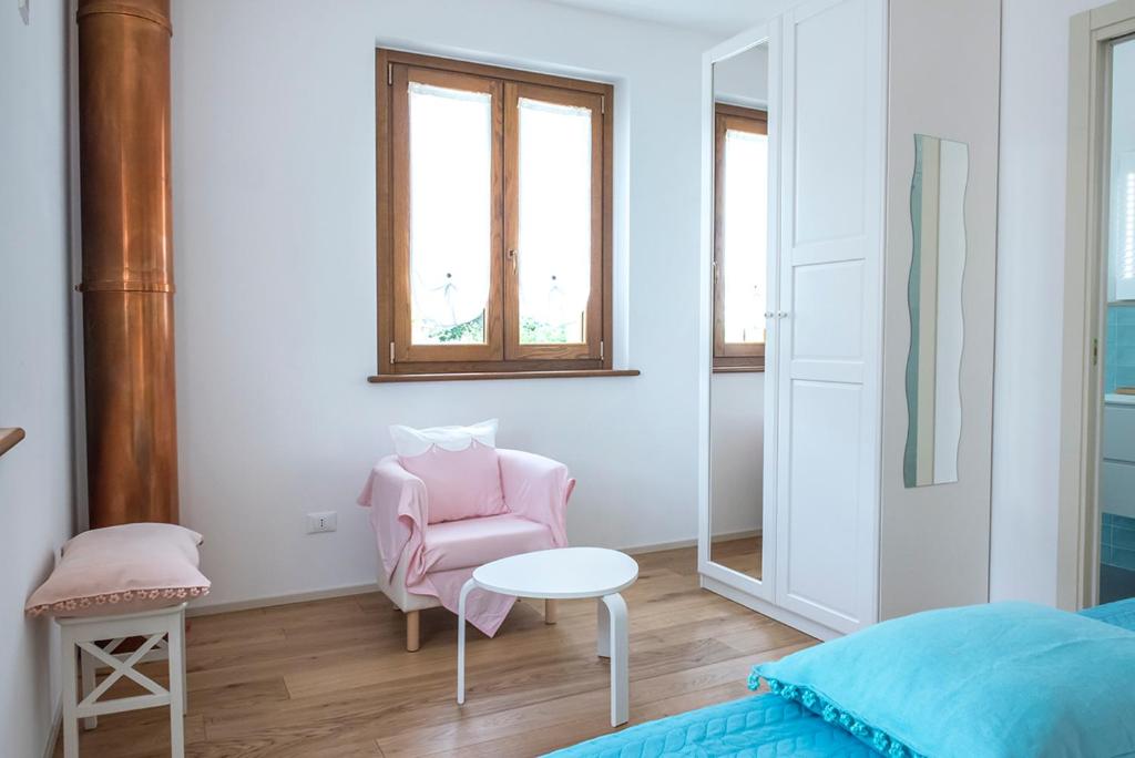 Postel nebo postele na pokoji v ubytování Casa del Fattore
