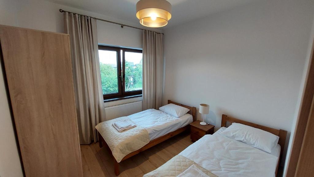 Posteľ alebo postele v izbe v ubytovaní Apartamenty Starowiejska 39, Ryczów - 10km od Zator Energylandia