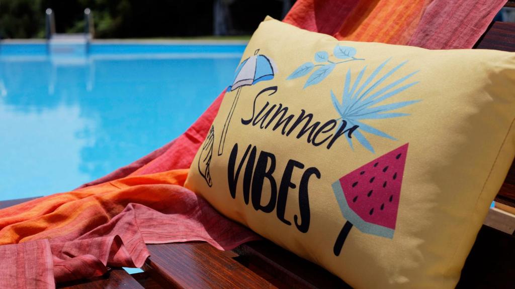 a pillow with a slice of watermelon on it at Habitat Villa Corfu in Dassia