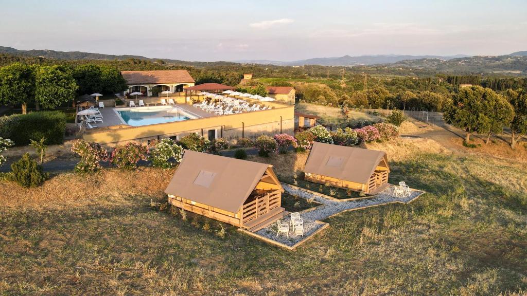 an aerial view of a house with a swimming pool at Glamping Debbiare in Riparbella