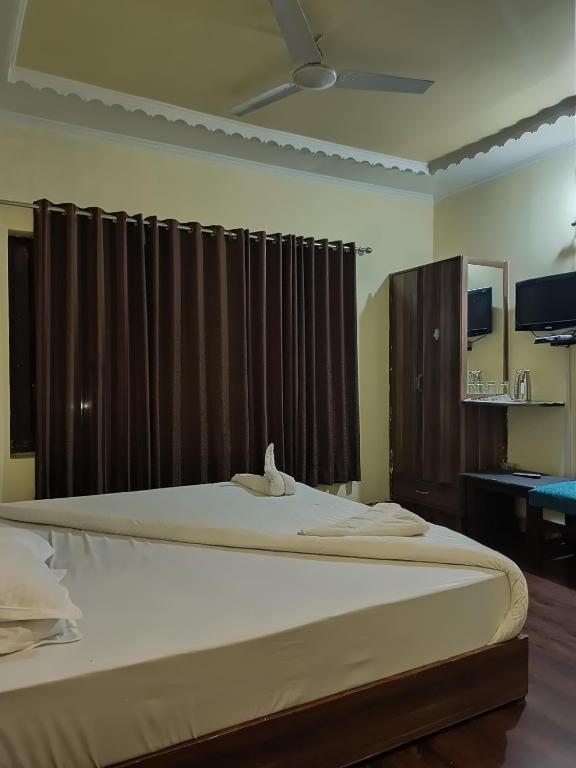 Postel nebo postele na pokoji v ubytování Hotel curio's All seasons