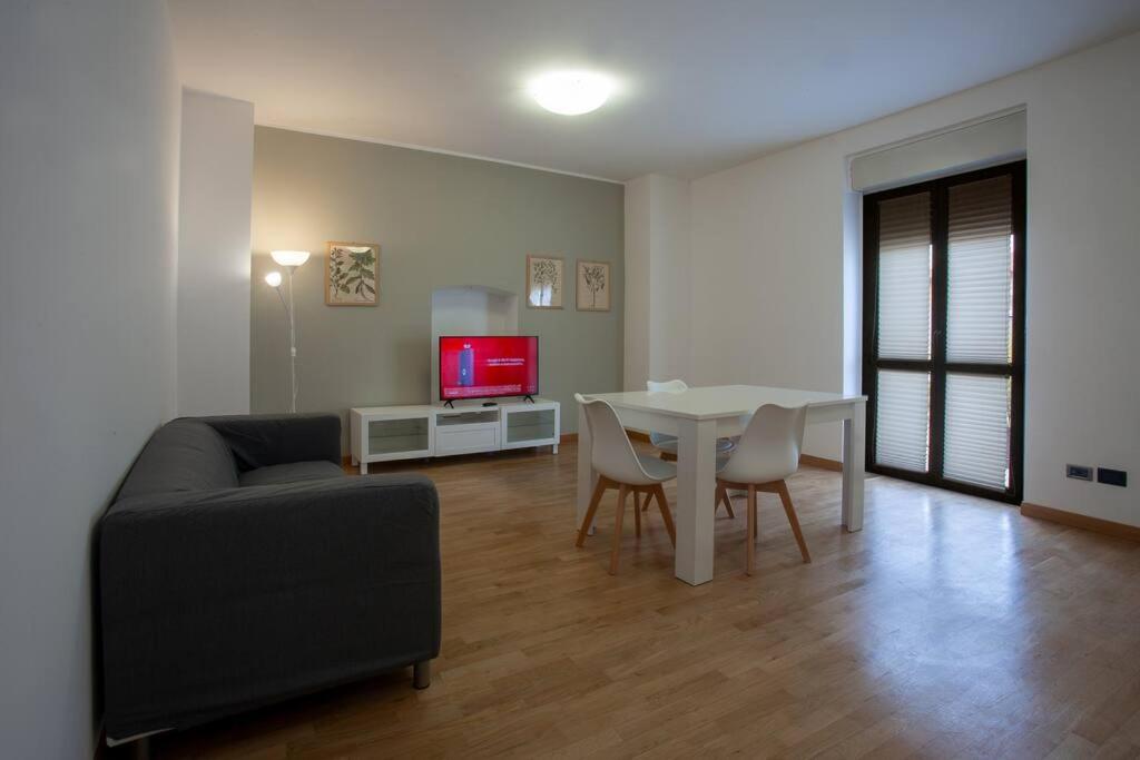 a living room with a table and a couch at Casa vacanze san salvo centro in San Salvo