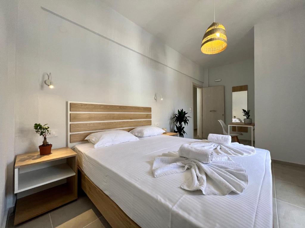 Ліжко або ліжка в номері Issos Residence