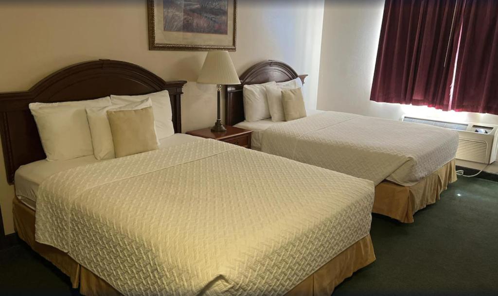 Postel nebo postele na pokoji v ubytování Scipio Hotel