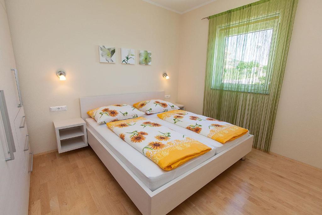 Postel nebo postele na pokoji v ubytování Villa Lilli - Appartements Kroatien