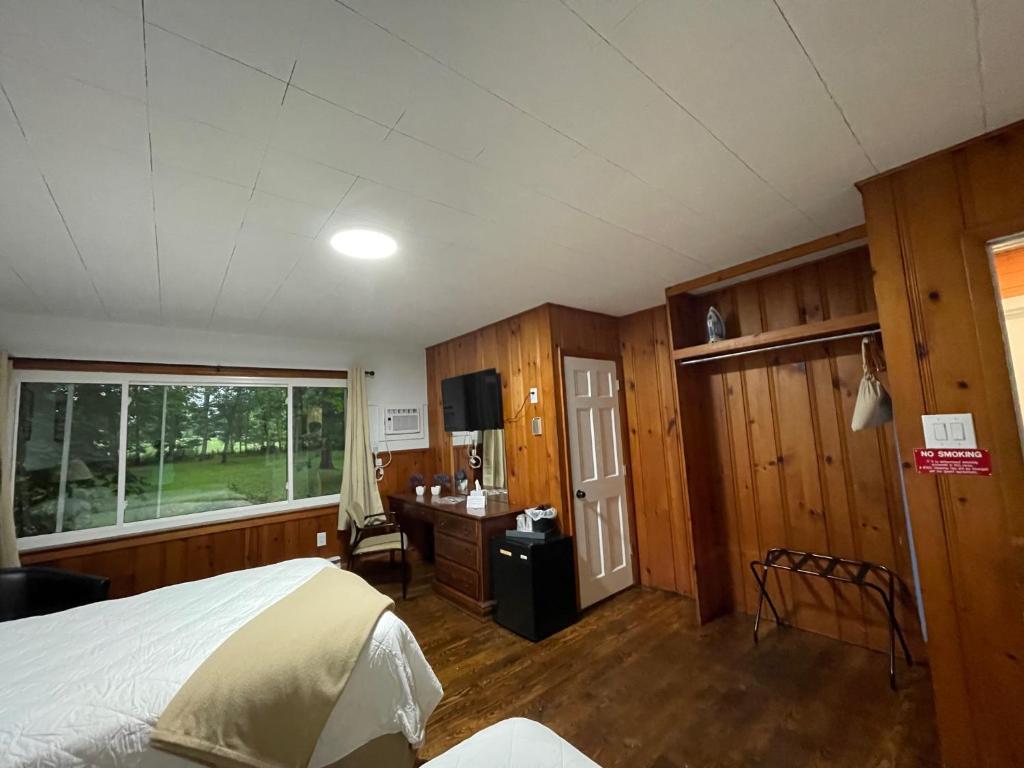 Postel nebo postele na pokoji v ubytování New Hope Lodge
