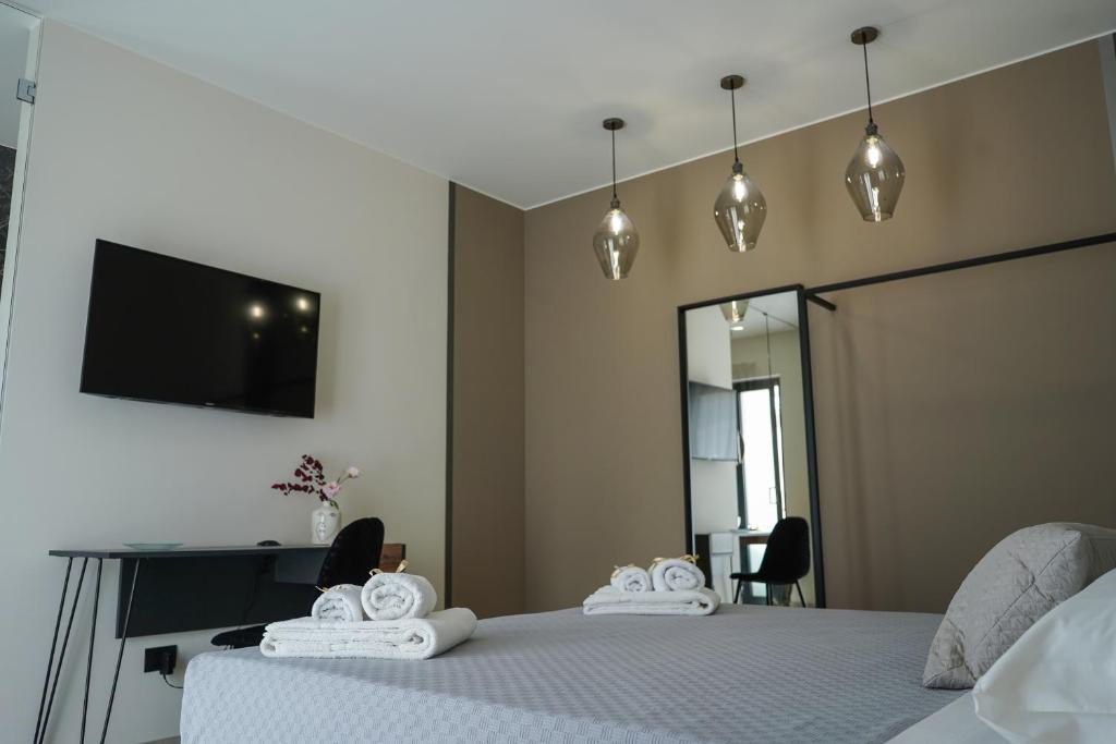 Postel nebo postele na pokoji v ubytování Thalassa Rooms