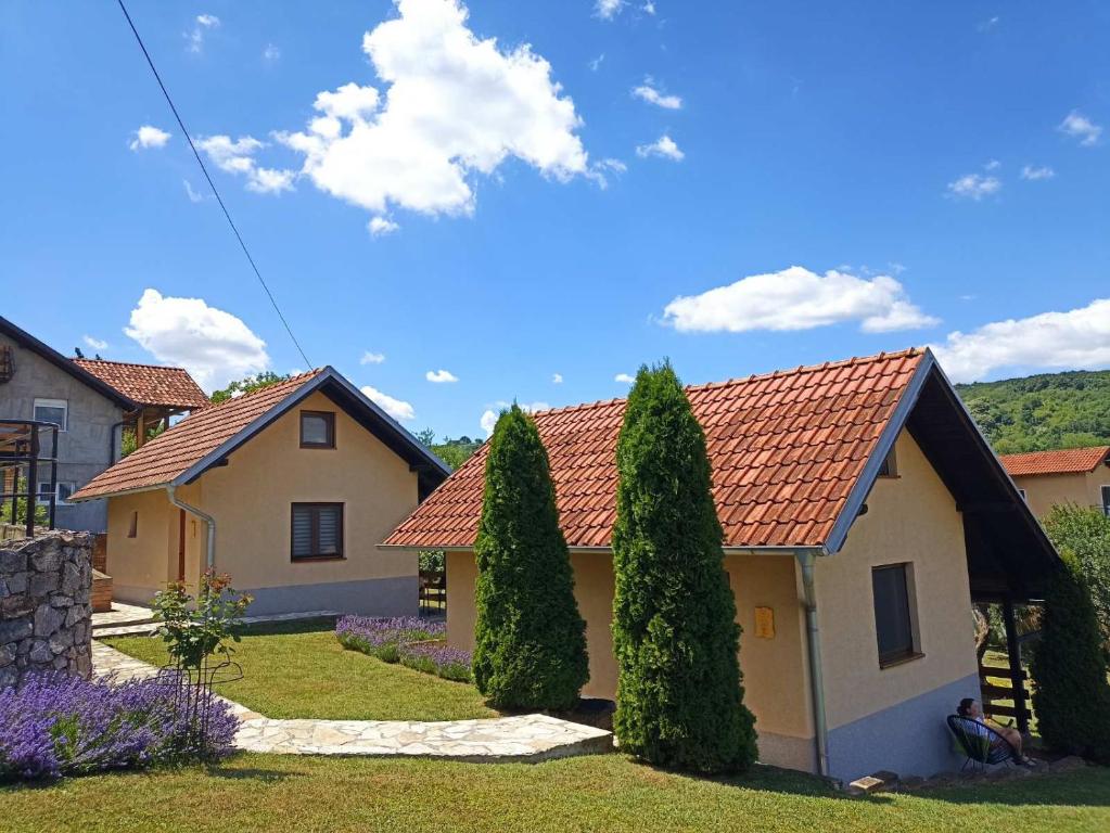 a house with trees in the front yard at Garden 022 in Vrdnik