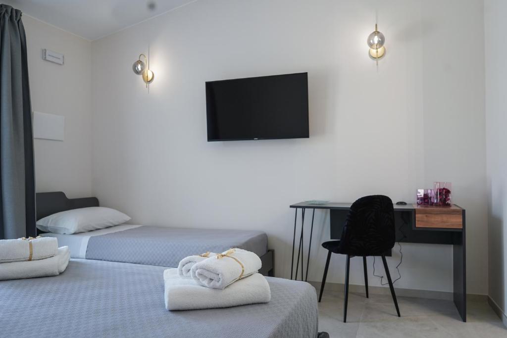 Postel nebo postele na pokoji v ubytování Thalassa Rooms