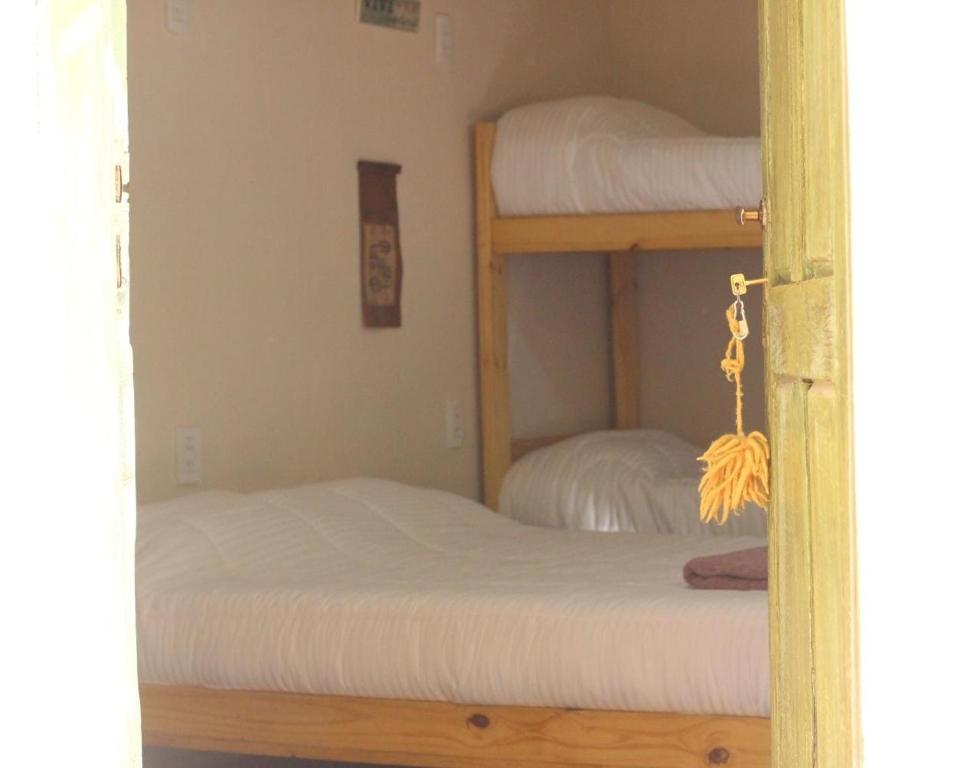 Postel nebo postele na pokoji v ubytování Cielito Lindo
