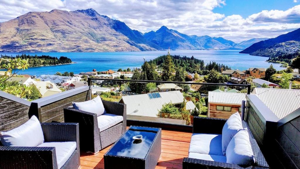 a balcony with a view of a lake and mountains at Stunning Home with Amazing Wakatipu Lake Views in Queenstown
