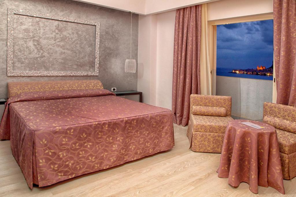 Postel nebo postele na pokoji v ubytování Hotel Santa Lucia Le Sabbie d'Oro