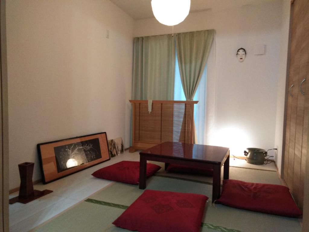 Postel nebo postele na pokoji v ubytování guest house 鎌倉記憶