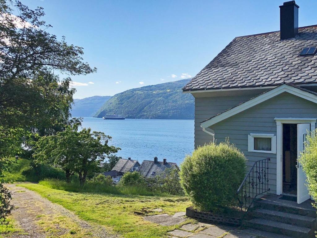 a house with a view of a body of water at Holiday home Utvik II in Utvik
