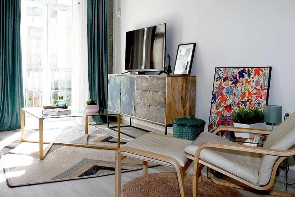 Televízia a/alebo spoločenská miestnosť v ubytovaní ISG Apartments Feria 106